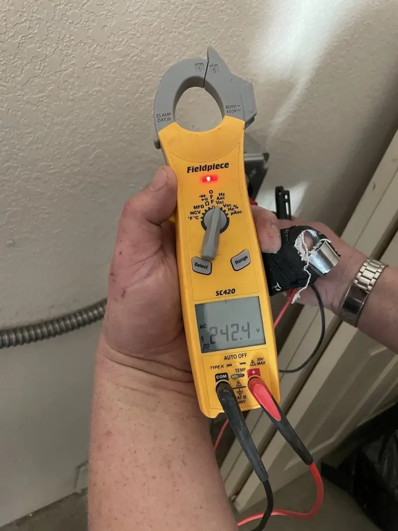 Voltage testing with clamp meter during Whole House Surge Protector in Steger